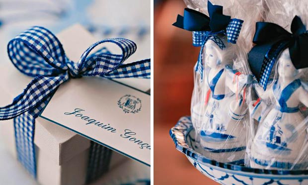 Caixinha branca com fita azul marcadora de lugar e bonequinhas de porcelana como minibalas de ovos de lembrancinha Caixinha branca com fita azul marcadora de lugar e bonequinhas de porcelana como minibalas de ovos de lembrancinha