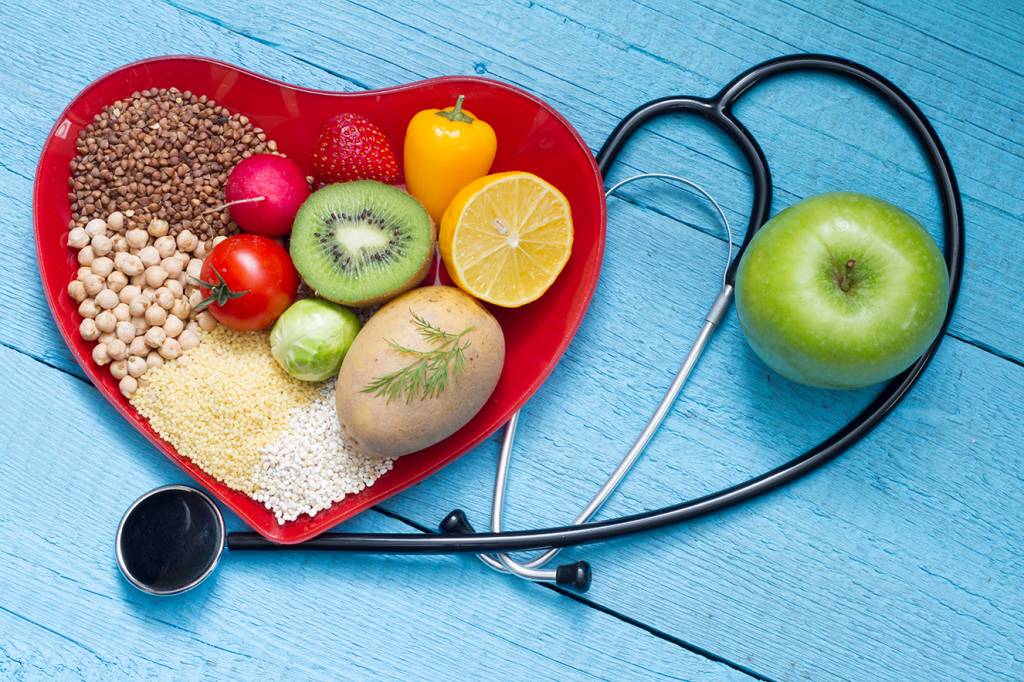 Food on heart plate with stethoscope Food on heart plate with stethoscope