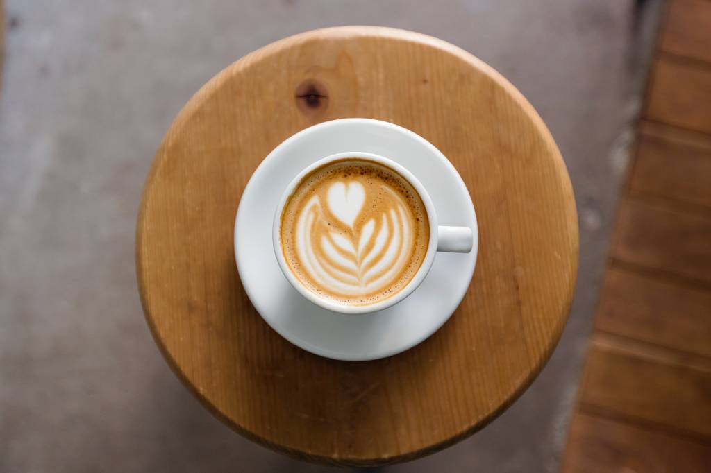 View of coffee cup with latte art straight from above