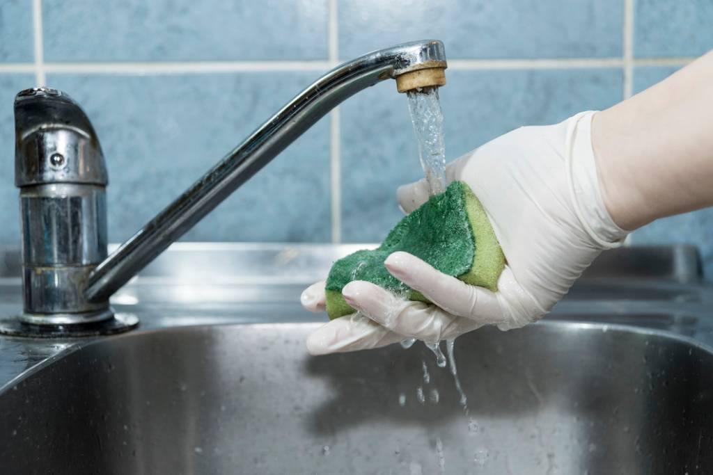 Washing sponge in the sink