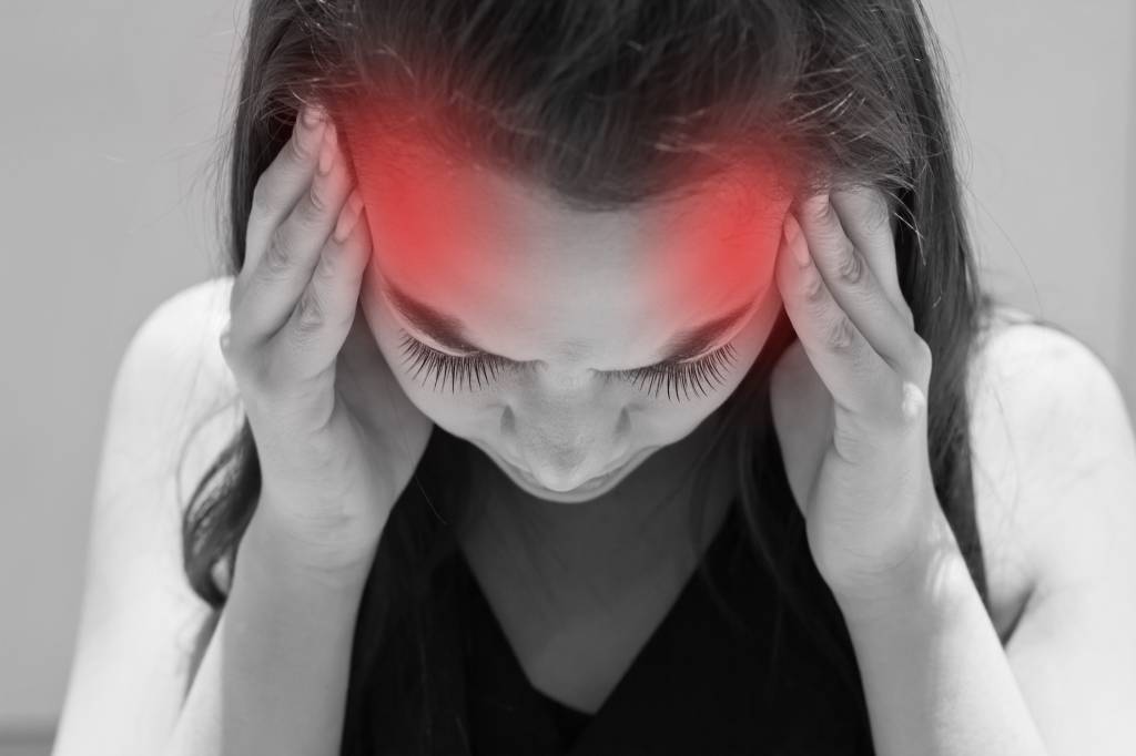 exhausted woman with headache, migraine, stress, hangover