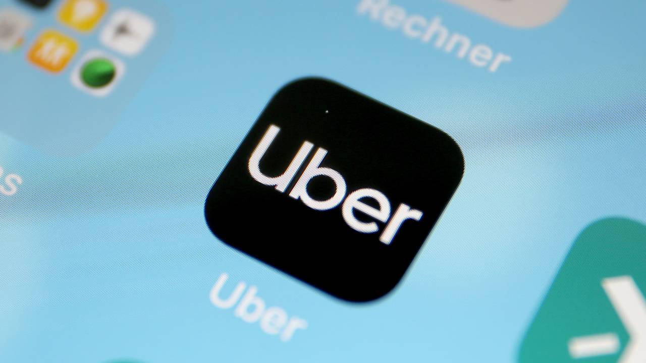 11 April 2019, North Rhine-Westphalia, Köln: The About app on a smartphone. Uber arranges trips in Cologne with immediate effect. Photo: Oliver Berg/dpa (Photo by Oliver Berg/picture alliance via Getty Images)