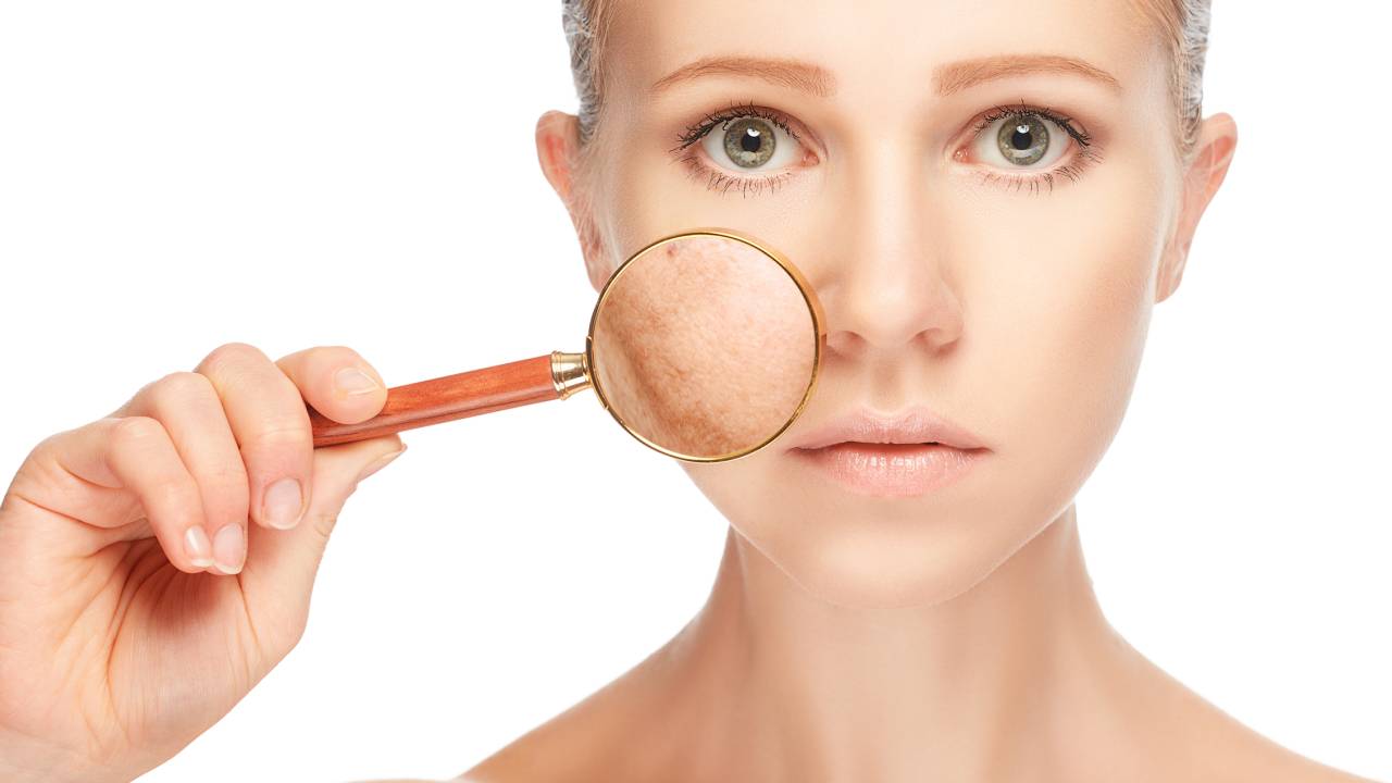 concept skincare. Skin of beauty young woman with magnifier before and after the procedure on a white background