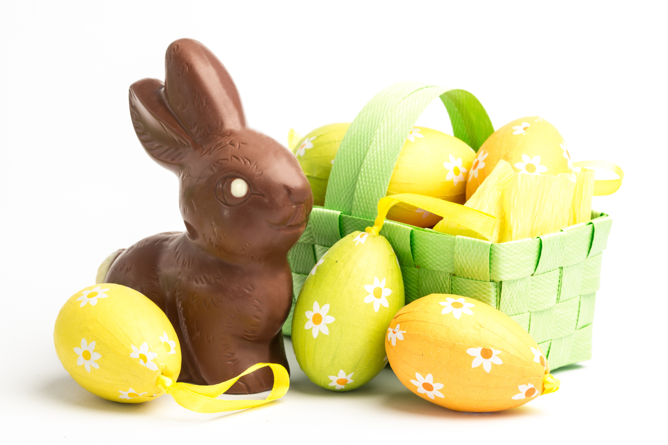 Easter eggs in a basket with chocolate bunny