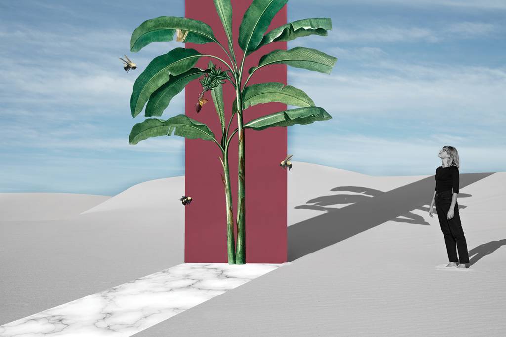 Fashion model looking at maroon portal while standing on white sand dunes Fashion model looking at maroon portal while standing on white sand dunes