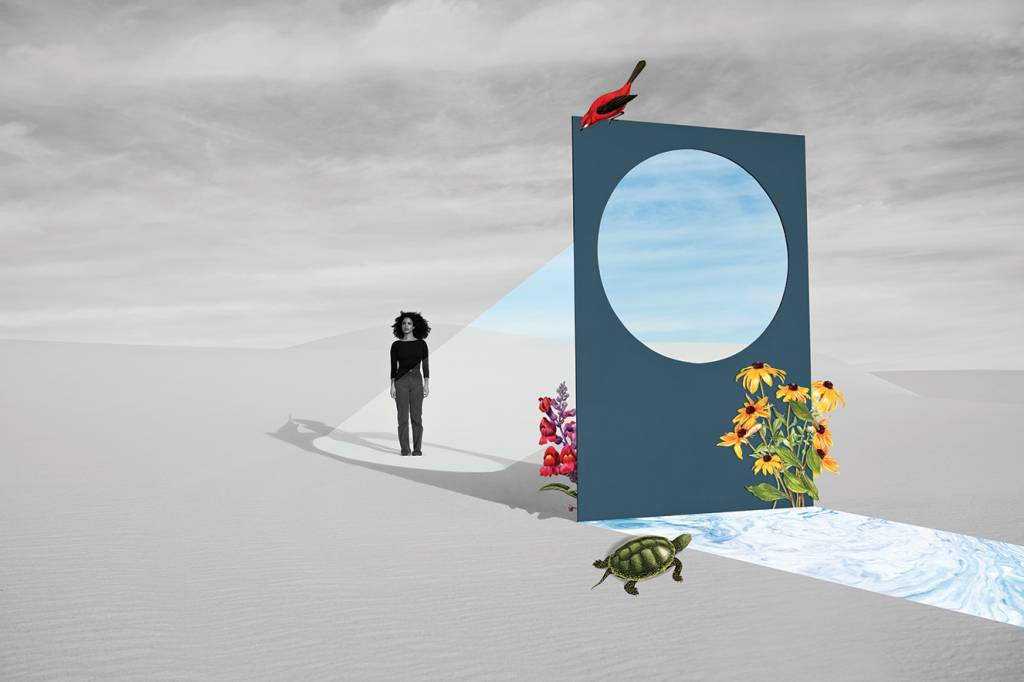 Young woman standing by portal at white desert during sunny day Young woman standing by portal at white desert during sunny day