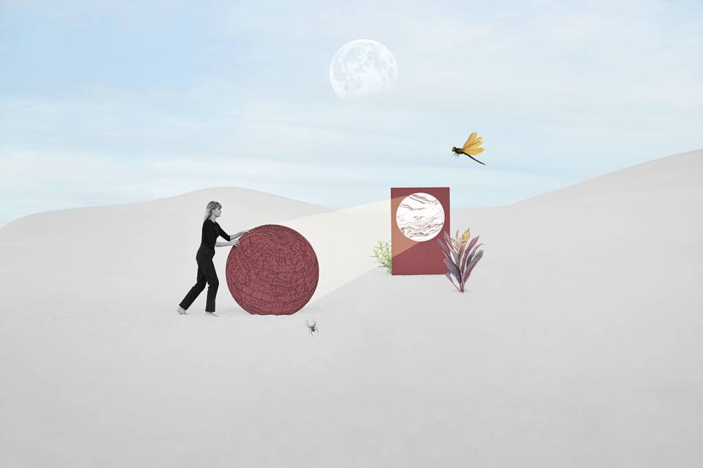 Side view of female model pushing circular portal at white desert against sky Side view of female model pushing circular portal at white desert against sky
